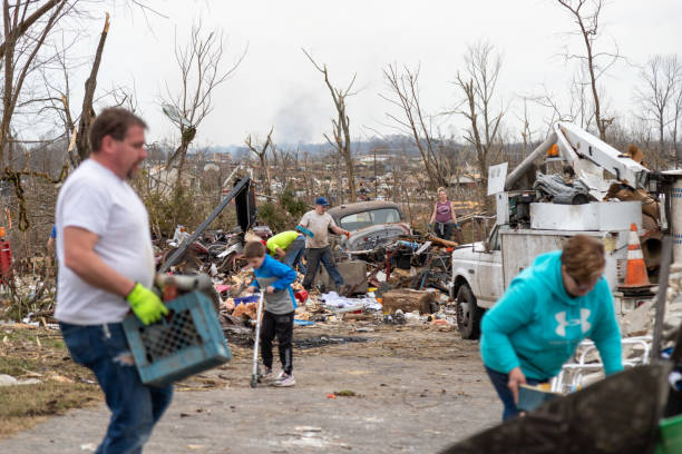 Homeowners sort through debris following a deadly tornado Wednesday, March 3, 2020, in Cookeville, Tennessee. Tornadoes ripped across Tennessee early Tuesday, damaging buildings and killing multiple people.