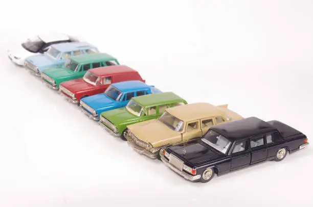 Collection of vintage metal die-cast car models isolated on the white background
