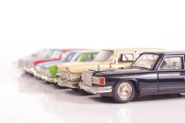 Collection of vintage metal die-cast car models isolated on the white background