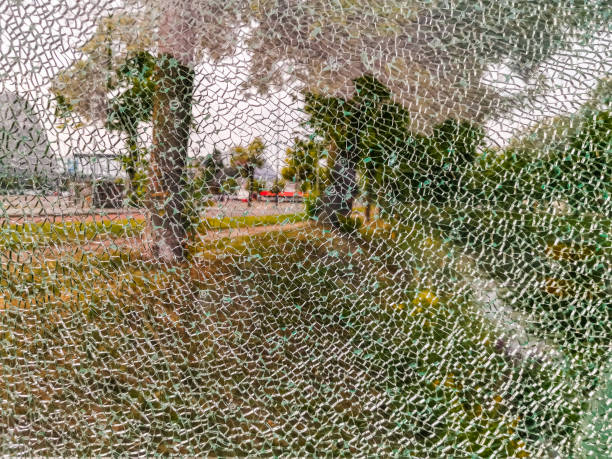 istock glass window completely cracked, scenery shining through, Shattered fragments, Abstract background 1210832247