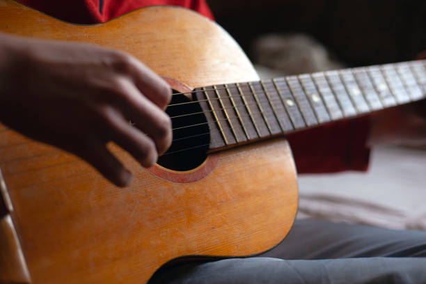 istock guitar strings. playing a musical instrument. guitar player 1210837389