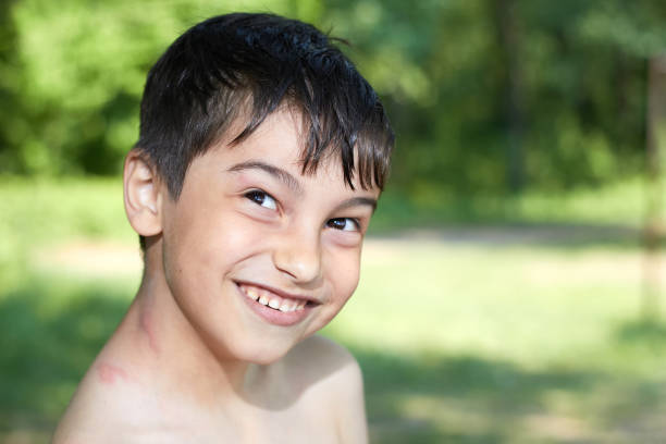 istock portrait of a small happy joyful boy smiling 1210837456