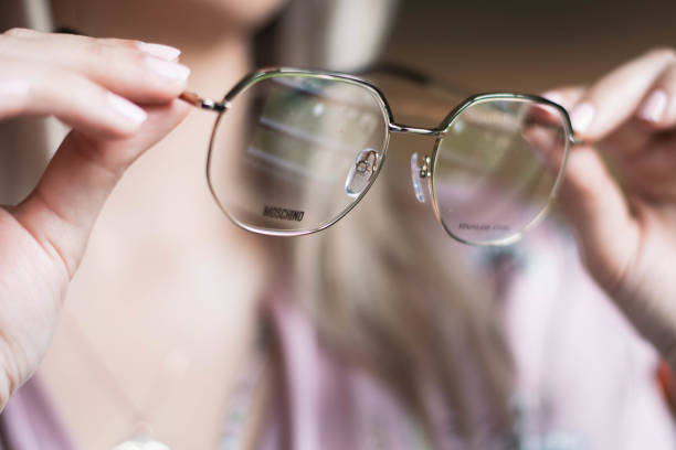 istock Woman holding glasses in hands 1210842439