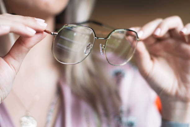 istock Woman holding glasses in hands 1210842454