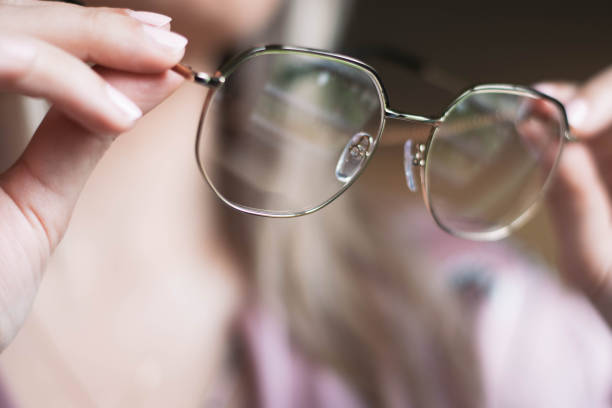 istock Woman holding glasses in hands 1210842461