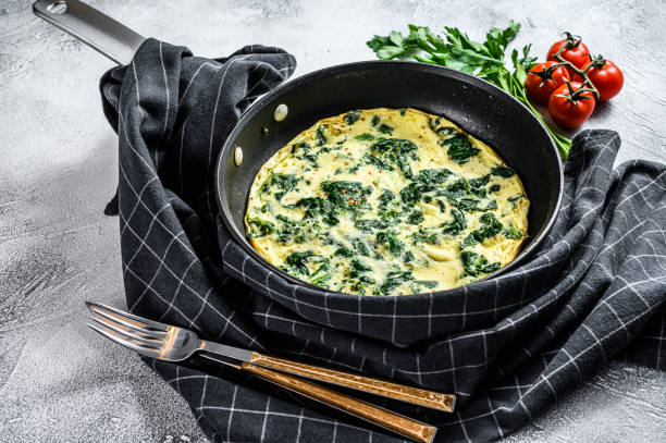 istock Italian Spinach and Cheese Omelet.  Gray background. Top view 1210842761