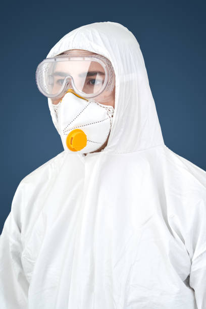 istock Doctor in protective workwear and face mask 1210842767
