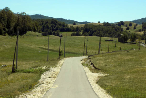 istock Country road through the valley 1210845009