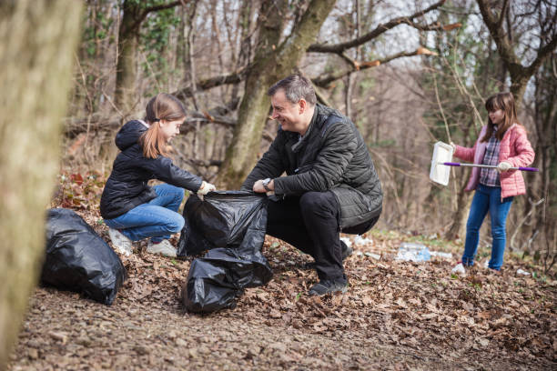 istock Man teaching children importance of clean environment 1210845773