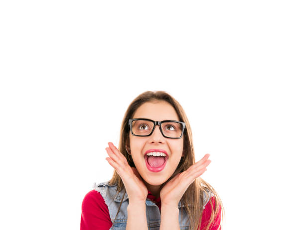 istock Surprised young woman looking up 1210848056