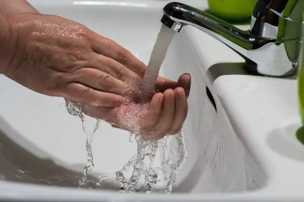 Photo of Woman hands in the sink soaped