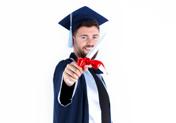 Graduation, Student holding a diploma in hand during the graduation success of the university, Concept education congratulations, Graduation Ceremony, In white background