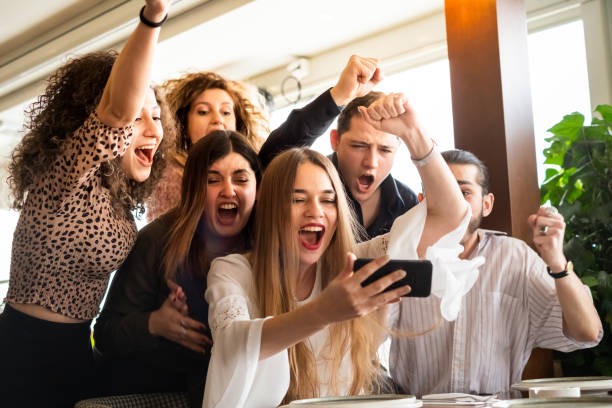 istock group of people watching the phone screen 1210860852