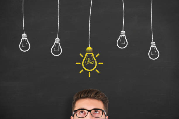 istock New idea concepts with light bulbs on a chalkboard background 1210869692