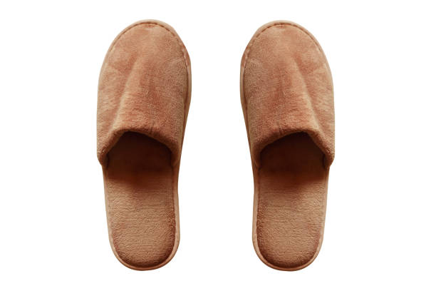 istock Brown home slippers isolated on white background. (clipping path) 1210882360
