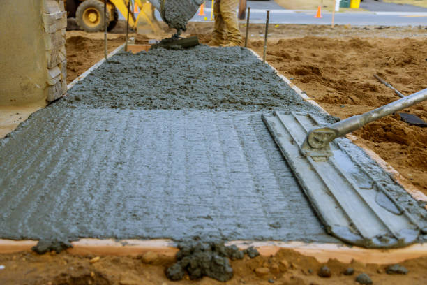 istock Mason building a screed coat cement at floor work. pouring concrete pavement 1210882555
