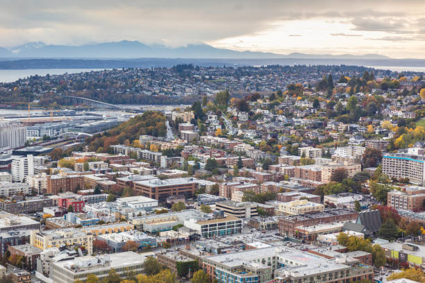 Seattle, Washington, USA - October 9, 2019: Aerial view of town in Seattle, small houses and buildings are on hill slope with changing color of trees in autumn.