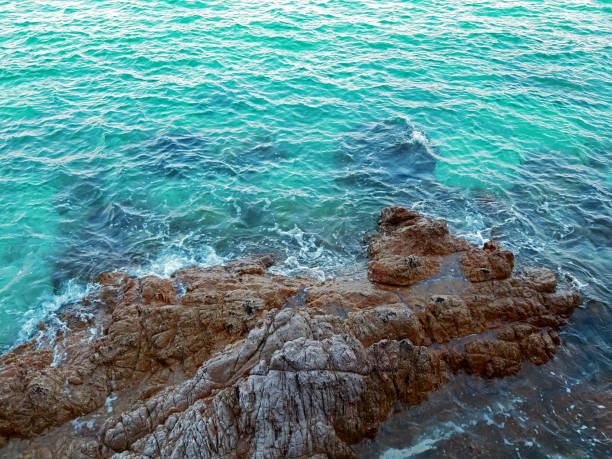 istock rock in the sea 1210887903