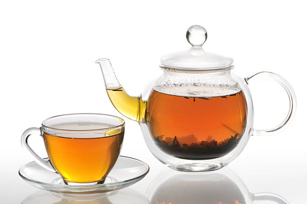 istock Cup with green tea and teapot on a white background 121089203