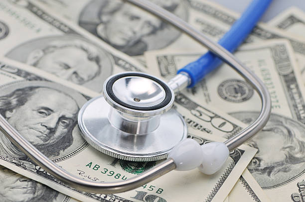 Stethoscope on dollars stock photo