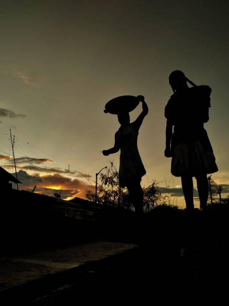 istock Peasant women on the way to home from work after sunset 1210894380