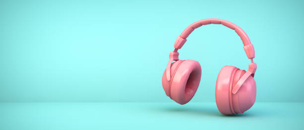 istock pink headphones on blue background 1210894922