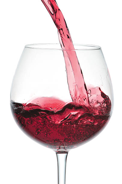 istock Stream of red wine falling in goblet 121089901