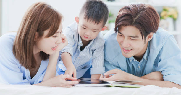 istock Parent read book with child 1210902092