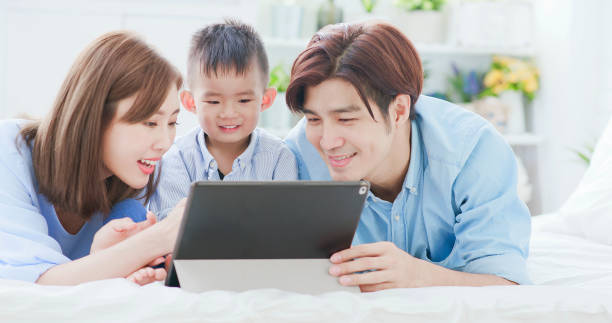 istock Parent play with child by tablet 1210902726