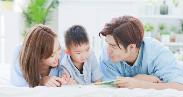 istock Parent read book with child 1210902774
