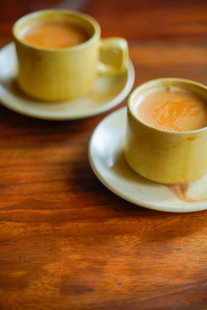 istock Tea in cup with saucer on wooden table 1210902796