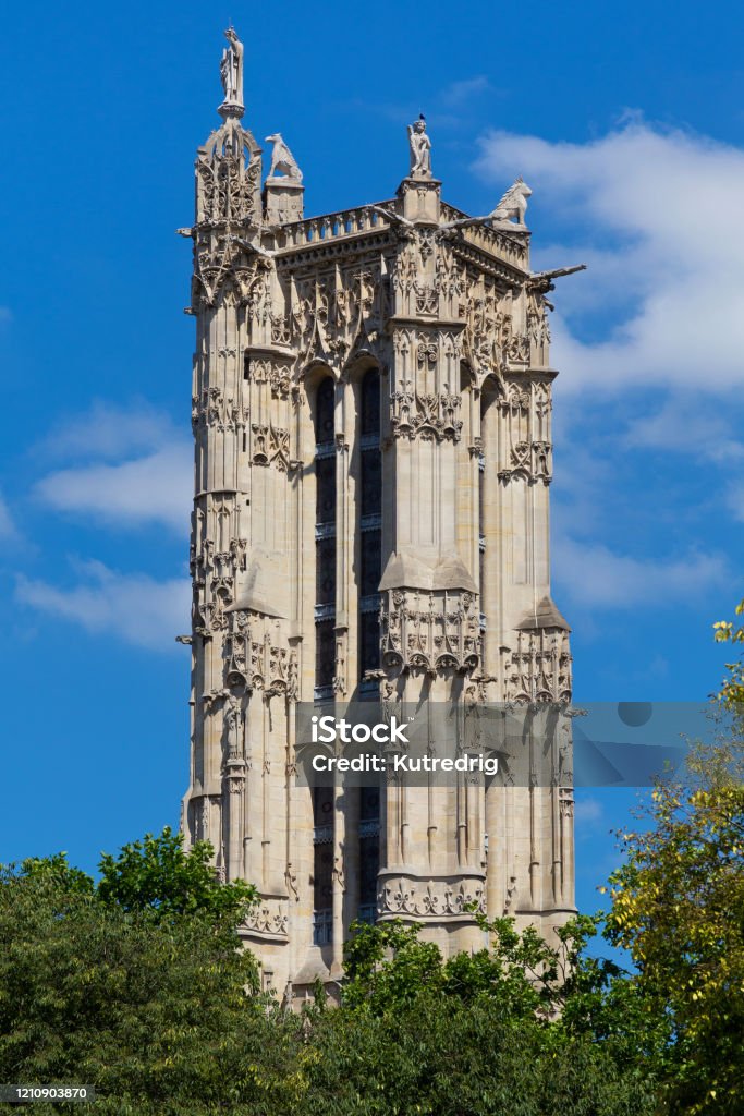 Saint-Jacques Tower in Paris, France. Is a 52-metre monument on Rue de Rivoli in Flamboyant Gothic style. Tower is all that remains of the former 16th-century Church of Saint-Jacques-de-la-Boucherie. Architecture Stock Photo