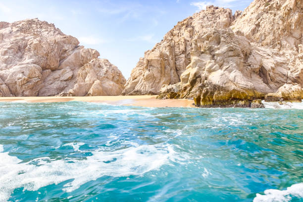 Ocean water and fancy rock formation the sand beach. Vacation and travel concept