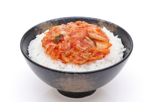 Korean food, cooked white rice with kimchi in a bowl