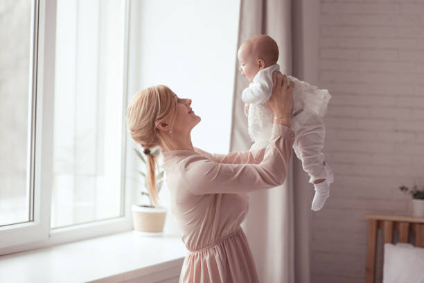 istock Baby on mother hands 1210907045