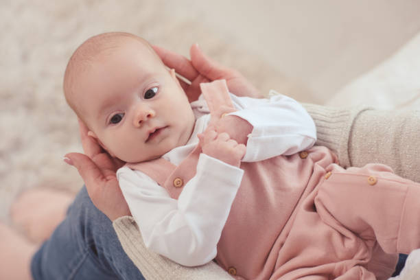 istock Baby on mother hands 1210907063