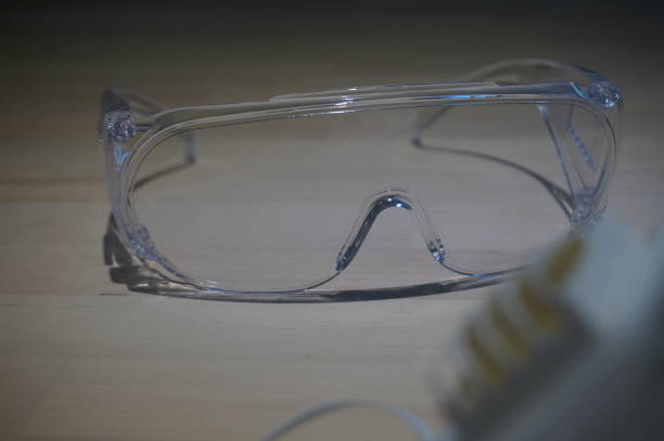 istock Virus protection equipment on the table include sensitizer sprayer respiratory mask and glasses 1210910289
