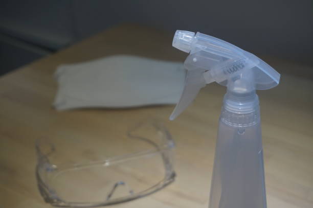 istock Virus protection equipment on the table include sensitizer sprayer respiratory mask and glasses 1210910820