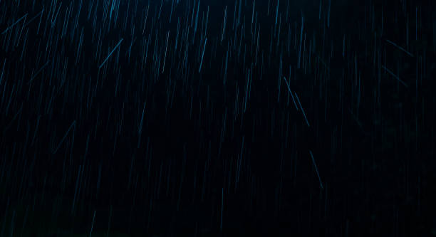 istock Water droplets like raindrops falling With a black background 1210911247