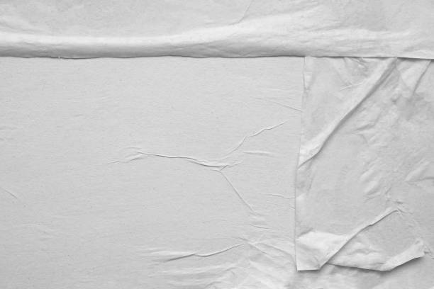 istock Blank white crumpled and creased paper poster texture background 1210912987