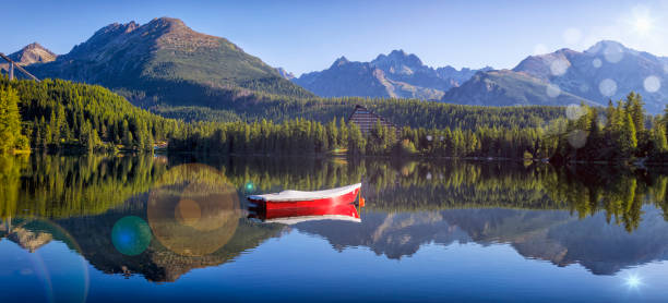 Summer holiday morning at the Strbske Pleso mountain lake, Slovakia Summer holiday morning at the Strbske Pleso mountain lake, National Park High Tatra, Slovakia pleso stock pictures, royalty-free photos & images