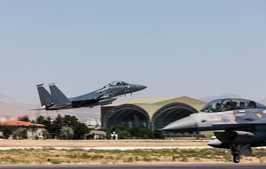 Tucson, Arizona, USA - March 24, 2023: American flags blow in the wind at the 2023 Thunder and Lightning Over Arizona airshow.