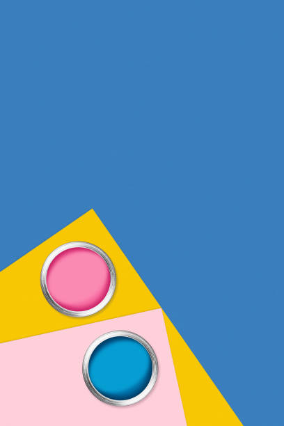 istock Two cans of paint on color background. 1210926179