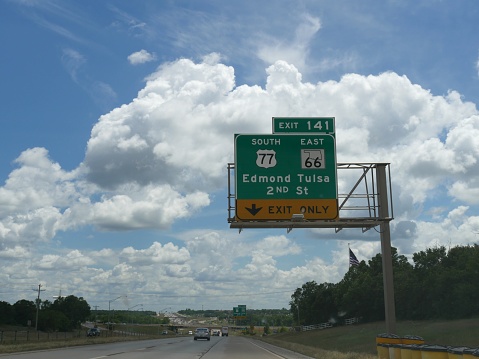 Oklahoma City, USA-April 2017: Directional sign with exits to Edmond and Tulsa on a beautiful day.