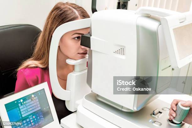 Beautiful Woman Having An Eye Lens Exam Stock Photo - Download Image Now - Tomography, Retina, Eye