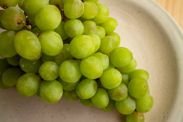 istock Deliciousgrapes on a ceramic plate 9 1210927528