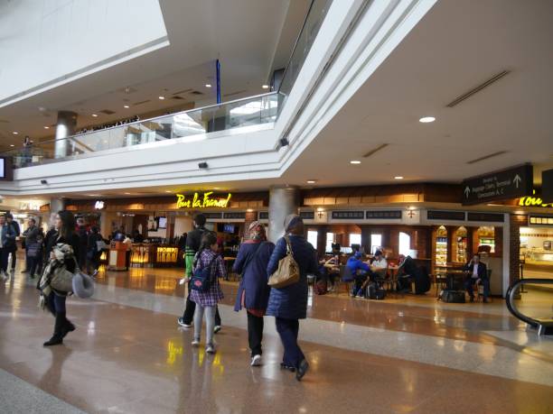 Passengers walking inside the Denver International Airport. Denver, Colorado-March 2018: Passengers walking inside the Denver International Airport. stopover stock pictures, royalty-free photos & images