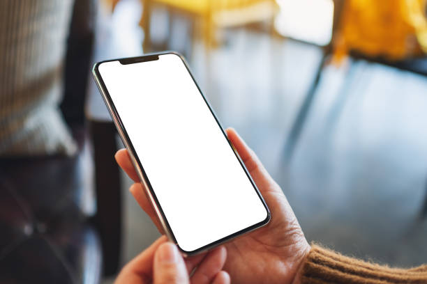 istock a woman holding black mobile phone with blank desktop screen 1210930361