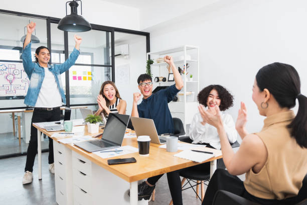 istock Happy Asian business people working in office 1210932714