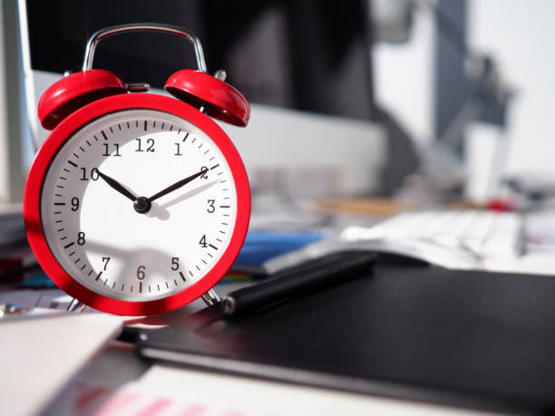 istock Alarm clock is on desktop, close-up watch dial 1210933721